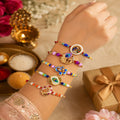 Elegant Dazzling Rakhi for Brother with Roli Tikka, Pooja Coin & Card, Pack of 8