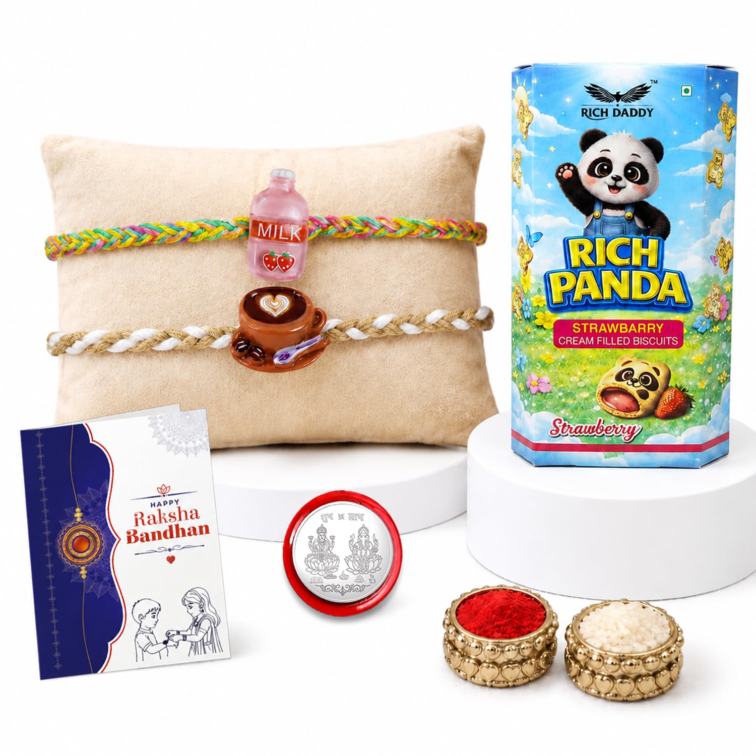 A gift set featuring a biscuit box, two braided bracelets on a pillow, a greeting card, a silver coin, and small bowls of