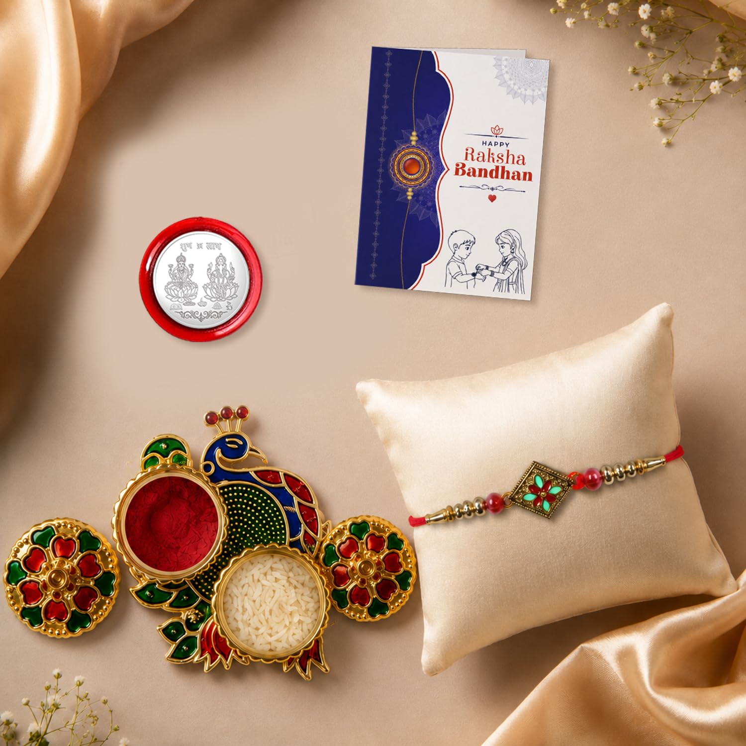 Multicolor floral bracelet rakhi with a peacock design pooja thali and accessories.