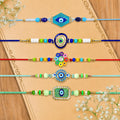 Designer Auspicious Rakhi for Brother with Roli Tikka & Greeting Card, Pack of 8