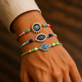 Designer Graceful Multicolor Evil Rakhi for Brother with Roli Tikka, Pack of 6