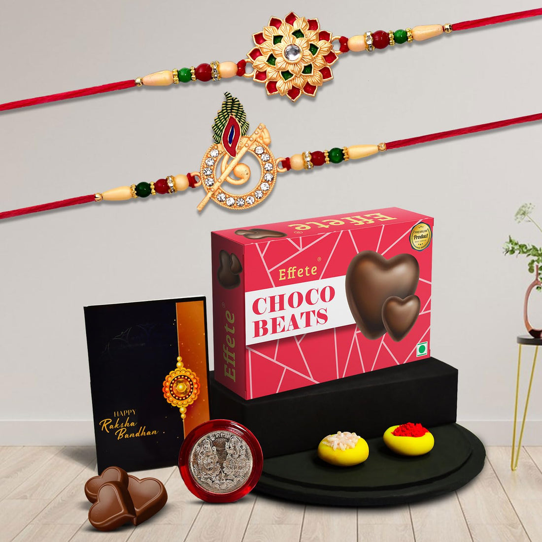 Designer Krishna flute and floral rakhi combo set including chocolates and silver coin
