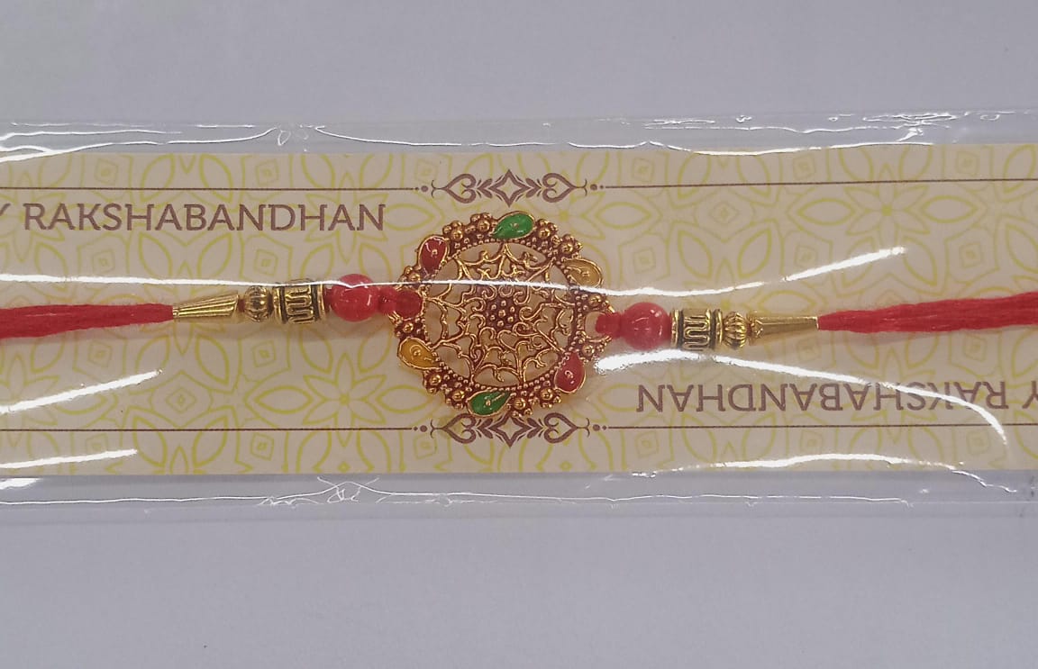 Intricately Designed Circular Rakhi with Multicolor Accents and Red Thread for Rakshabandhan