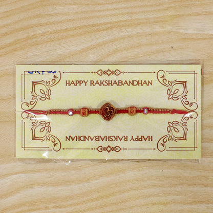 Red Swirl Stone Rakhi with Golden Detail and Beautiful Festive Centre Styling