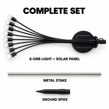 A complete set of the solar firefly light components laid out: the 8-orb light with solar panel, a metal stake, and a ground
