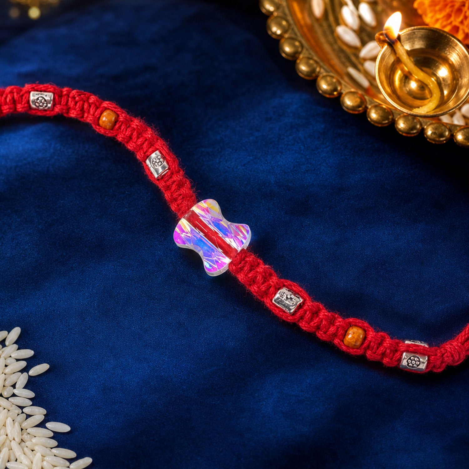 Red Braided Rakhi with an Iridescent Bow-Tie Shaped Crystal Bead