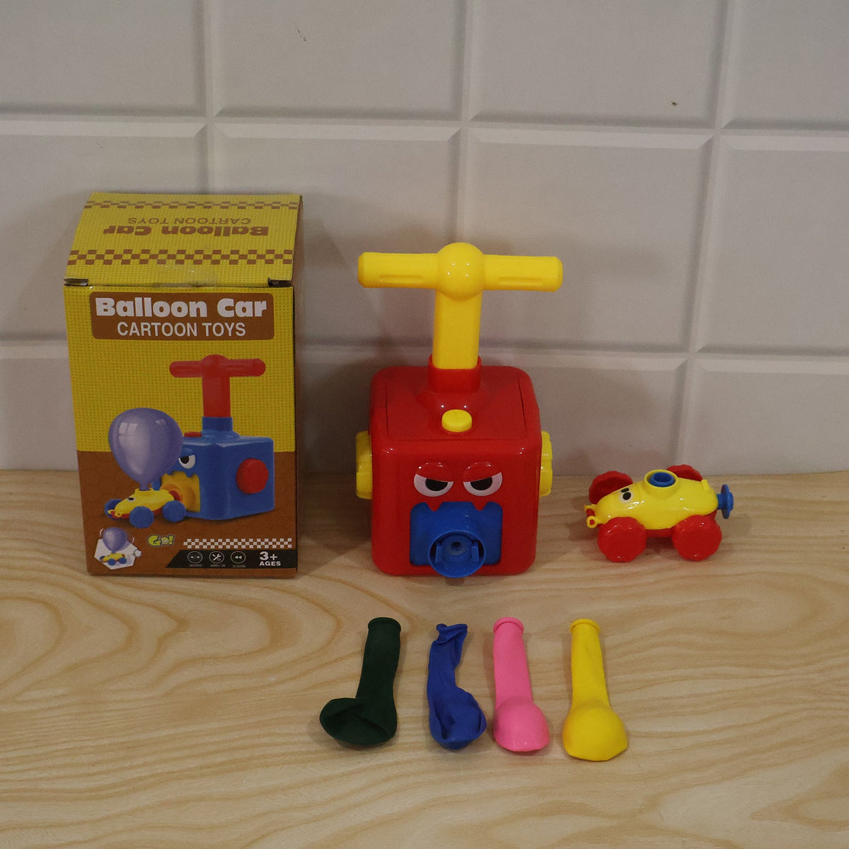 Several colourful balloons included with the balloon powered car launcher toy set