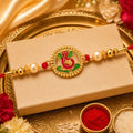 Ganesha Rakhi – Traditional Enamel & Golden Beads for Raksha Bandhan