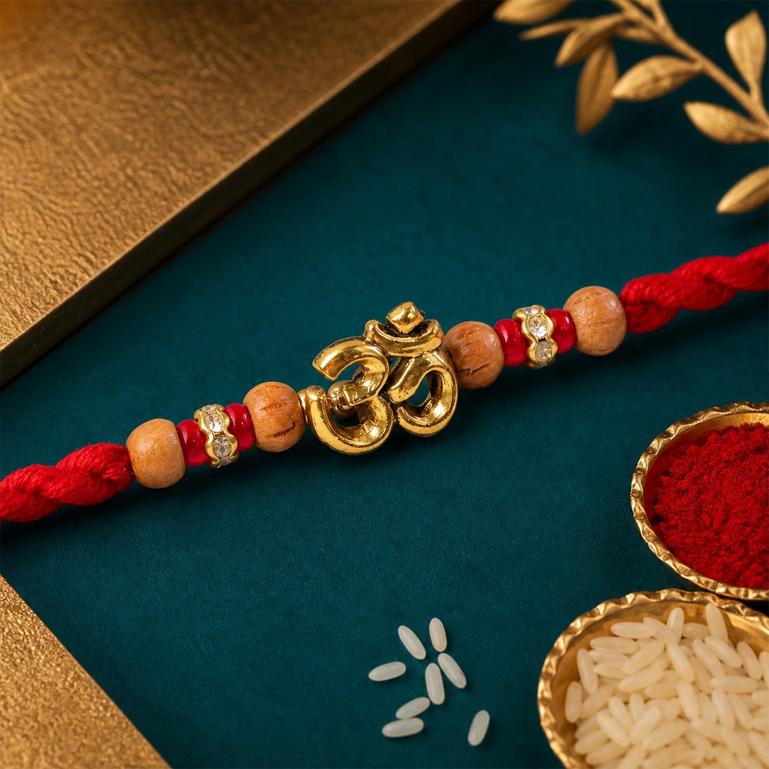 Navy-Red Thread Rakhi with Golden Om Pendant and Beaded Accents