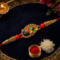 Peacock Rakhi – Elegant Designer Thread with Red Beads for Brother