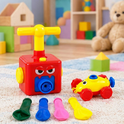 A red pump, yellow car, and four colorful deflated balloons are on a carpeted floor.