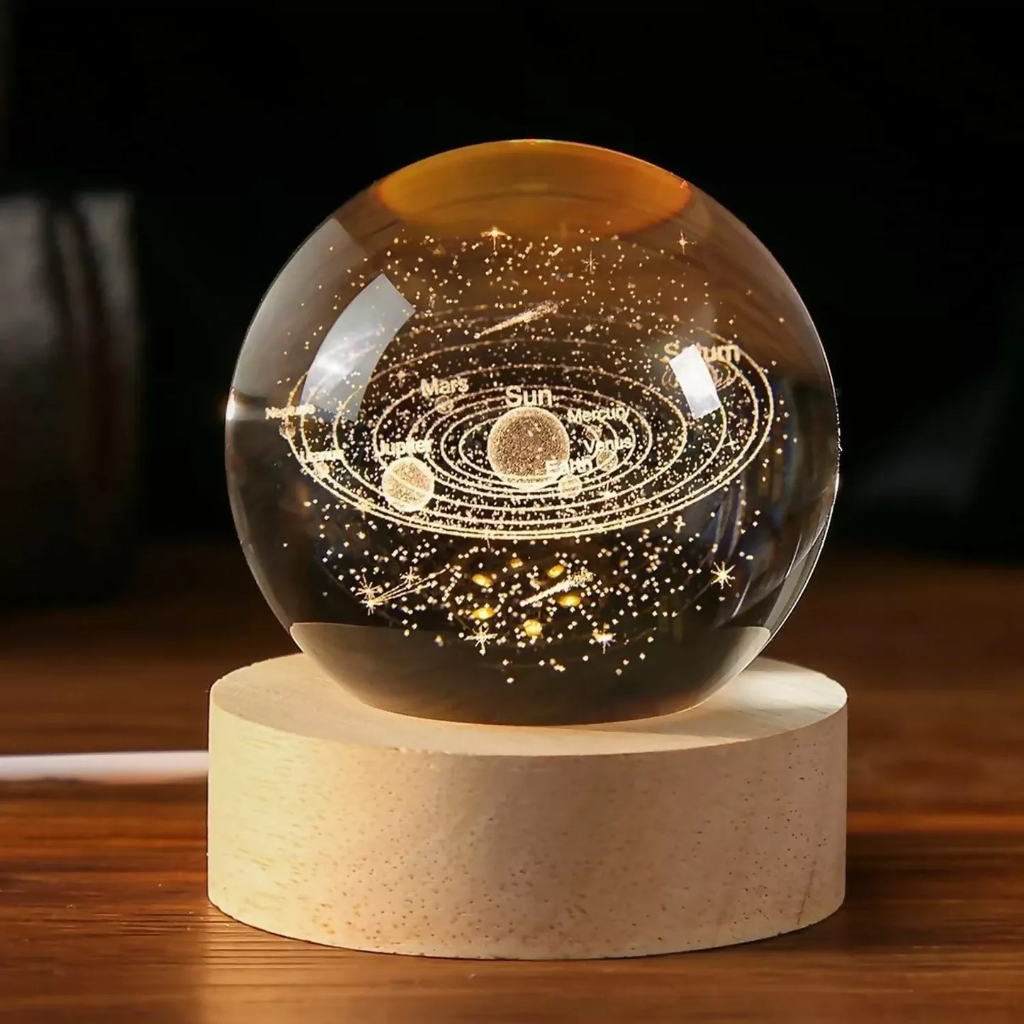 3D solar system LED lamp lit on a study desk