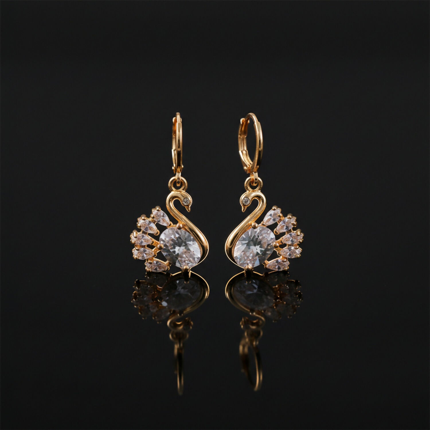 Stylish swan motif drop earrings featuring sparkling clear stones and hanging style