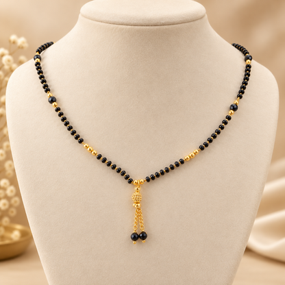 Black beaded mangalsutra with golden pendant detail
