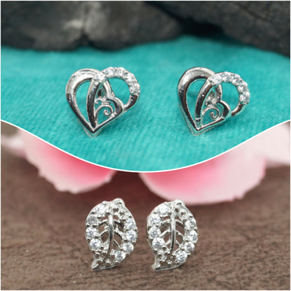 Set of silver-plated heart and leaf CZ stud earrings on white background