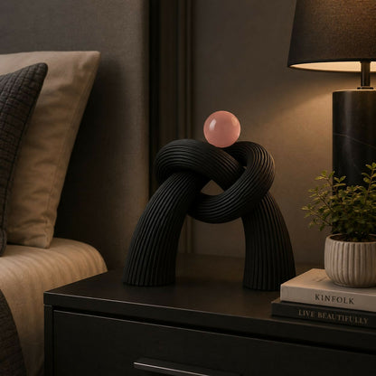 Elegant resin knot sculpture on a shelf, symbolizing unity, balance, and harmony