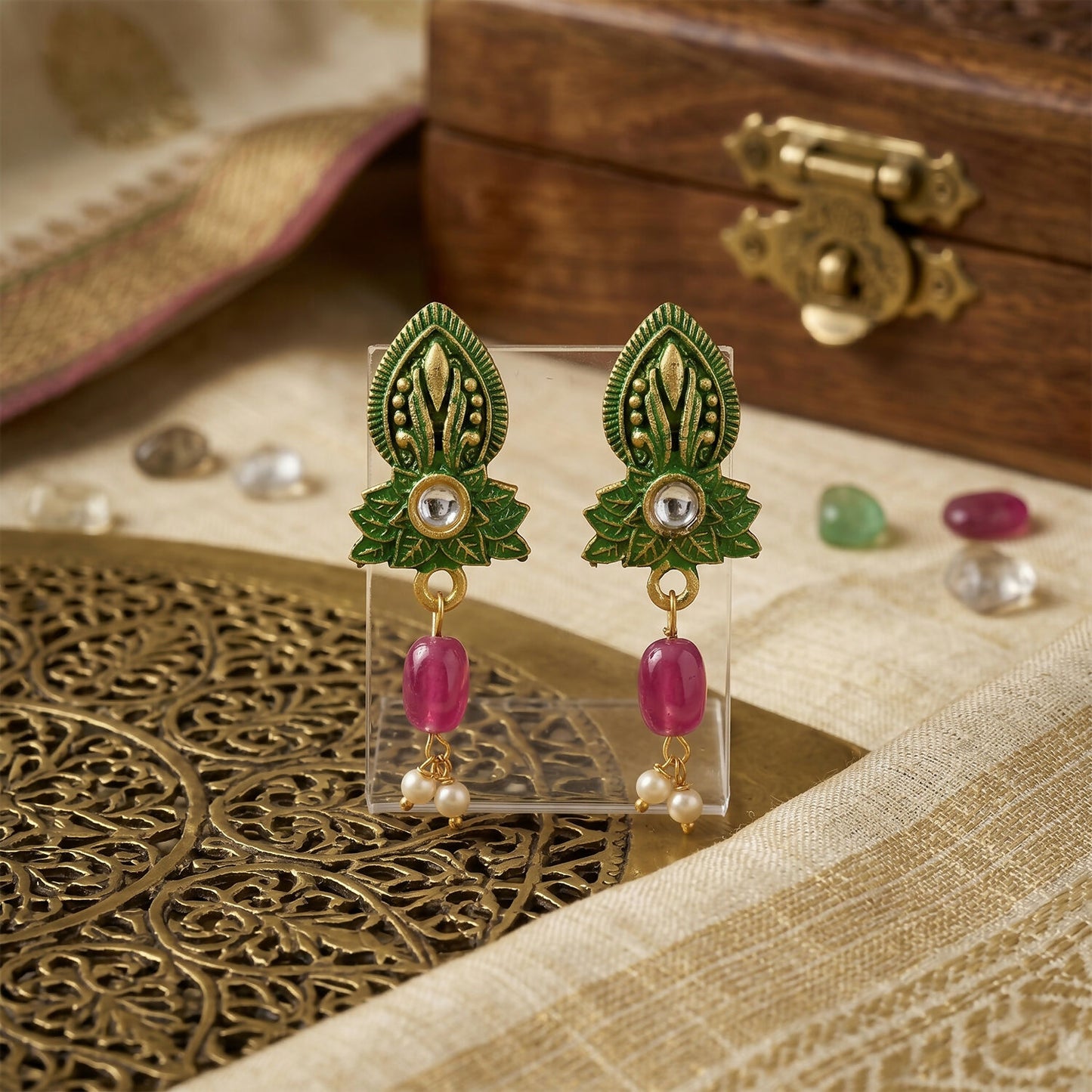 Close-up of green beads and detailed centerpiece
