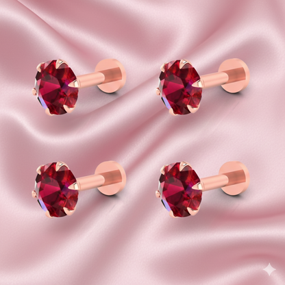 Close-up of single rose gold red ruby flat back nosepin stud showcasing crystal shine