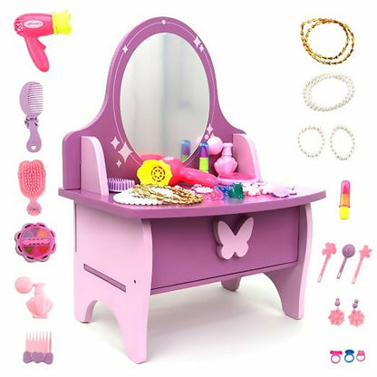 A purple and pink wooden vanity with an oval mirror, surrounded by various toy beauty accessories.