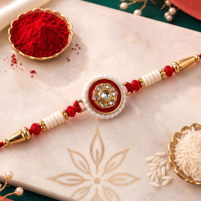 Close up of a red round Kundan Pearl Rakhi with intricate traditional design.