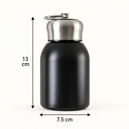 A black vacuum bottle with a silver cap and carry ring is shown with measurements of 13 cm height and 7.5 cm width.