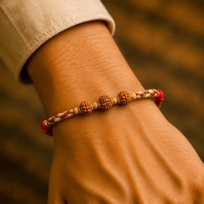 Rudraksha Style Devotional Rakhi with Braided Red Green Yellow Thread and Wooden Beads