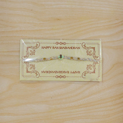 Beautiful Pearl and Stone Rakhi with Bright Beads and Elegant Raksha Bandhan Look