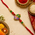 Spiritual Radha Krishna Metallic Rakhi for Brother with Peacock Feather Detail & Rhinestone Accents