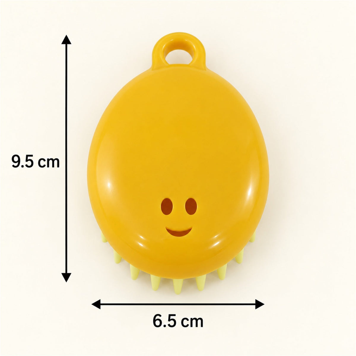 A yellow silicone scalp brush with light green bristles is displayed with measurements of 9.5 cm and 6.5 cm.