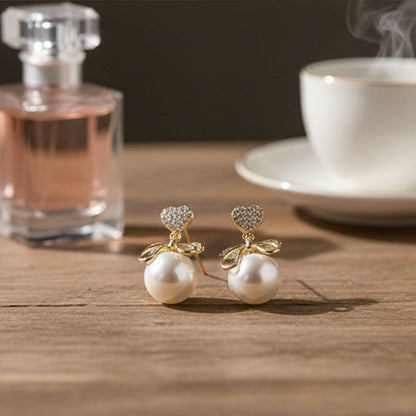 Heart Crystal and Pearl Bow Earrings worn by model