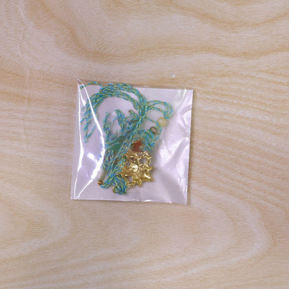 Sacred Nariyal Kalash Golden Metallic Motif Rakhi with Sea Green & Coral Beads