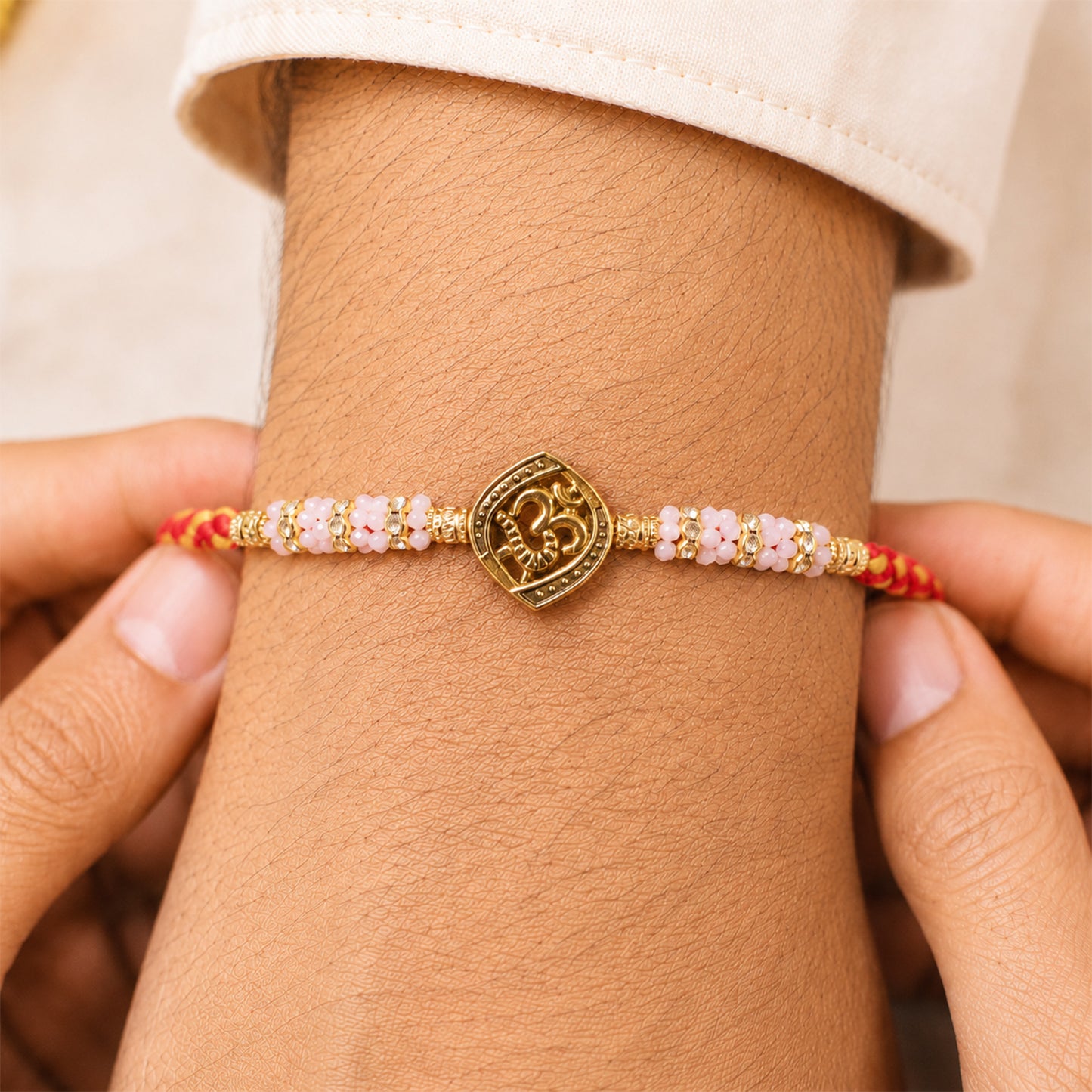 Silver Tone Designer Rakhi with Pastel Beads and Elegant Bracelet Style Finish