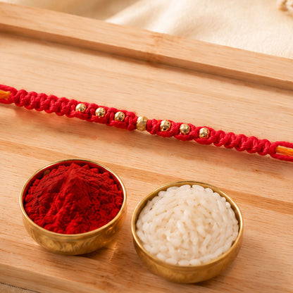 Minimal Red Stone Rakhi with Simple Beauty, Fine Beads and Festive Thread Detail