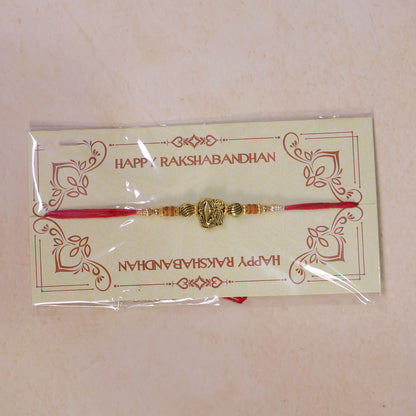 Red Thread Rakhi with Antique Gold Ganesha Pendant and Beaded Charms