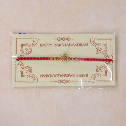 Navy-Red Thread Rakhi with Golden Om Pendant and Beaded Accents