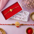 Shrinathji Face Rakhi – Golden with Red Enamel & Sandalwood Beads