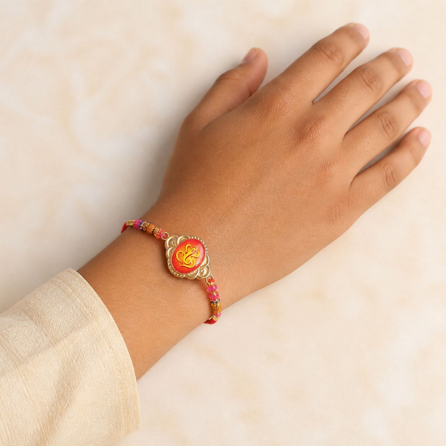 Ganesh Printed Motif Oval Floral Frame Rudraksha Beads Bhai Bhabhi Rakhi Lumba Set