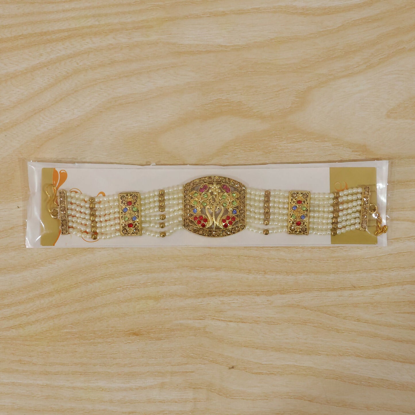 Bridal bracelet featuring pearls and colorful stones in floral pattern