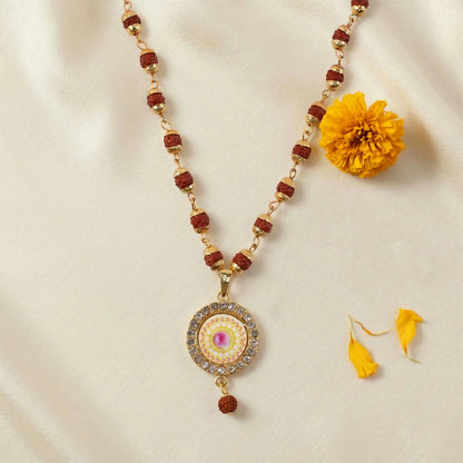 Close-up of Rudraksha beads and detailed gold pendant
