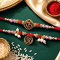 Graceful OM Symbol Bhai Bhabhi Rakhi with OM Medallion and Pearl Tassel for Gifting