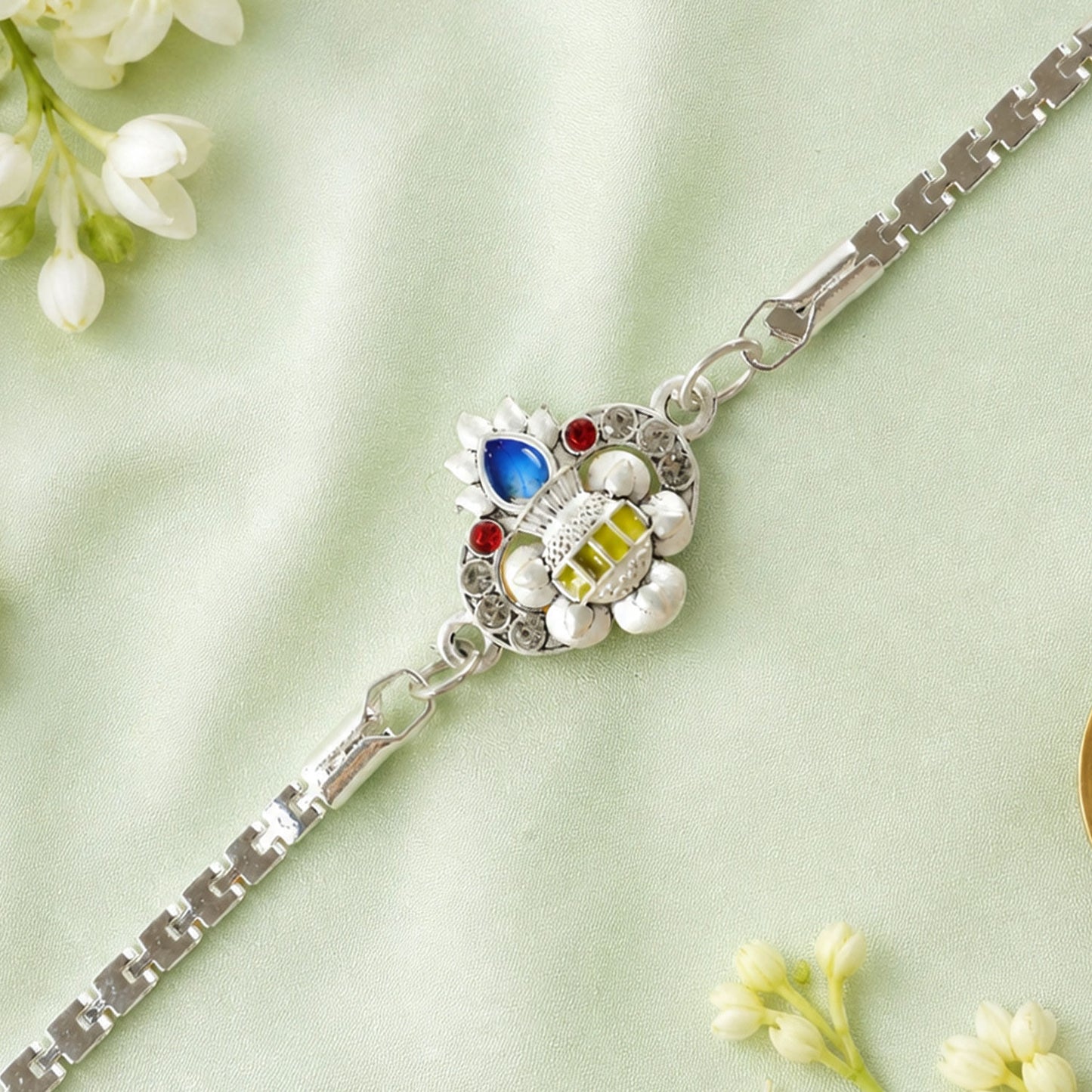 Kalash Lotus Petal Enamel Crystal Studded Silver Chain Designer Rakhi