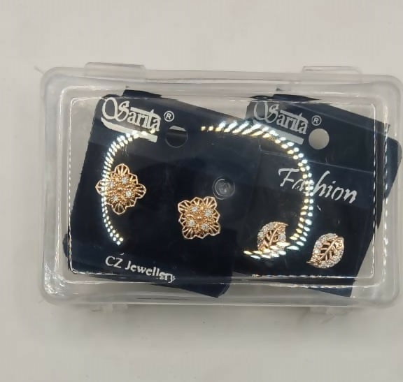 Cubic zirconia embellished gold plated stud earrings arranged for display