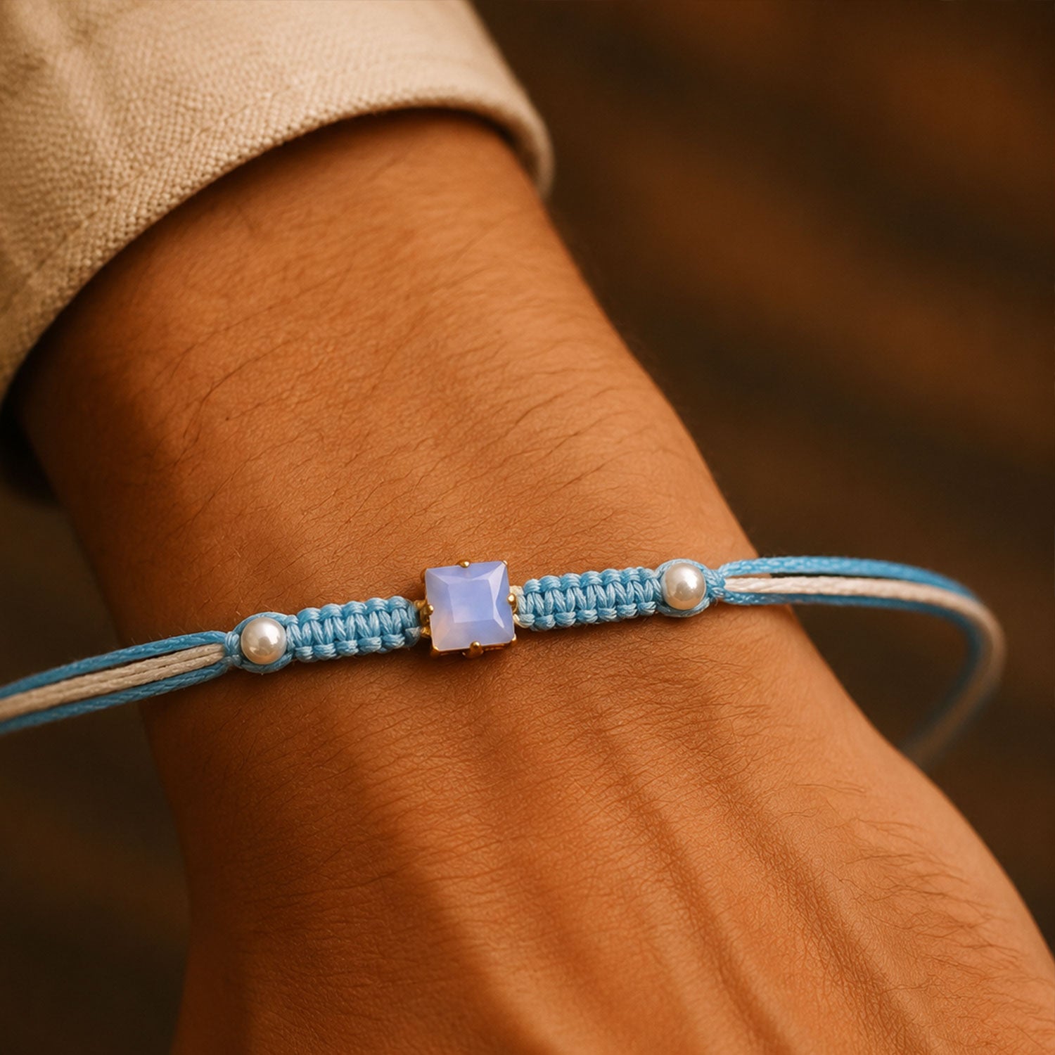 Blue Square Stone Macrame Rakhi with Pearl Beads, Silver Accents and Soft Thread