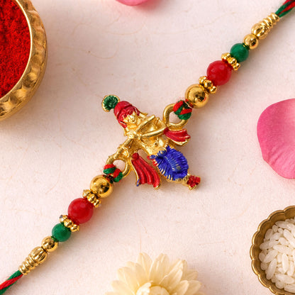 Lord Krishna Flute Pendant Rakhi with Red and Green Beads