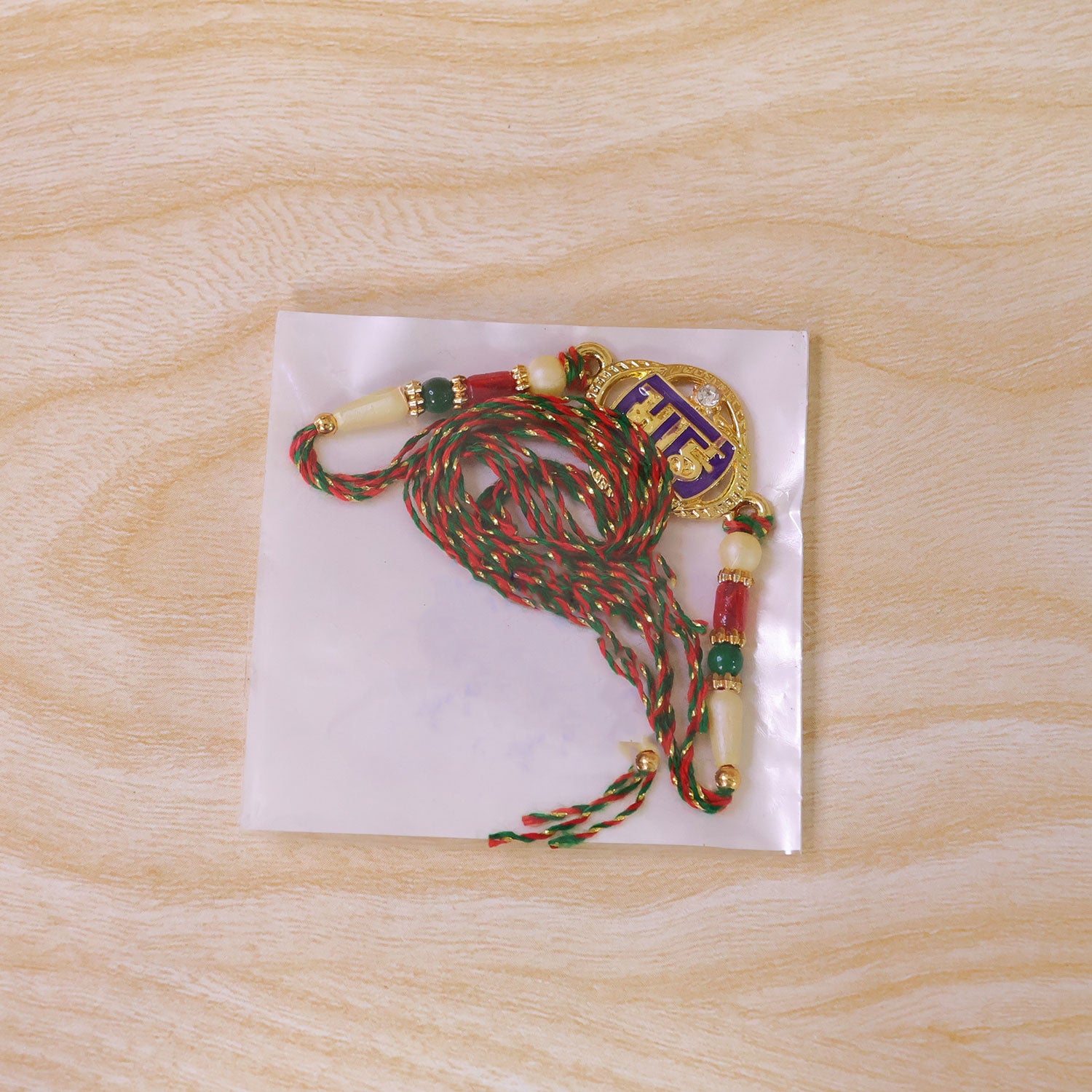 Bhai Text Pendant Rakhi with Purple Enamel and Kundan Stones