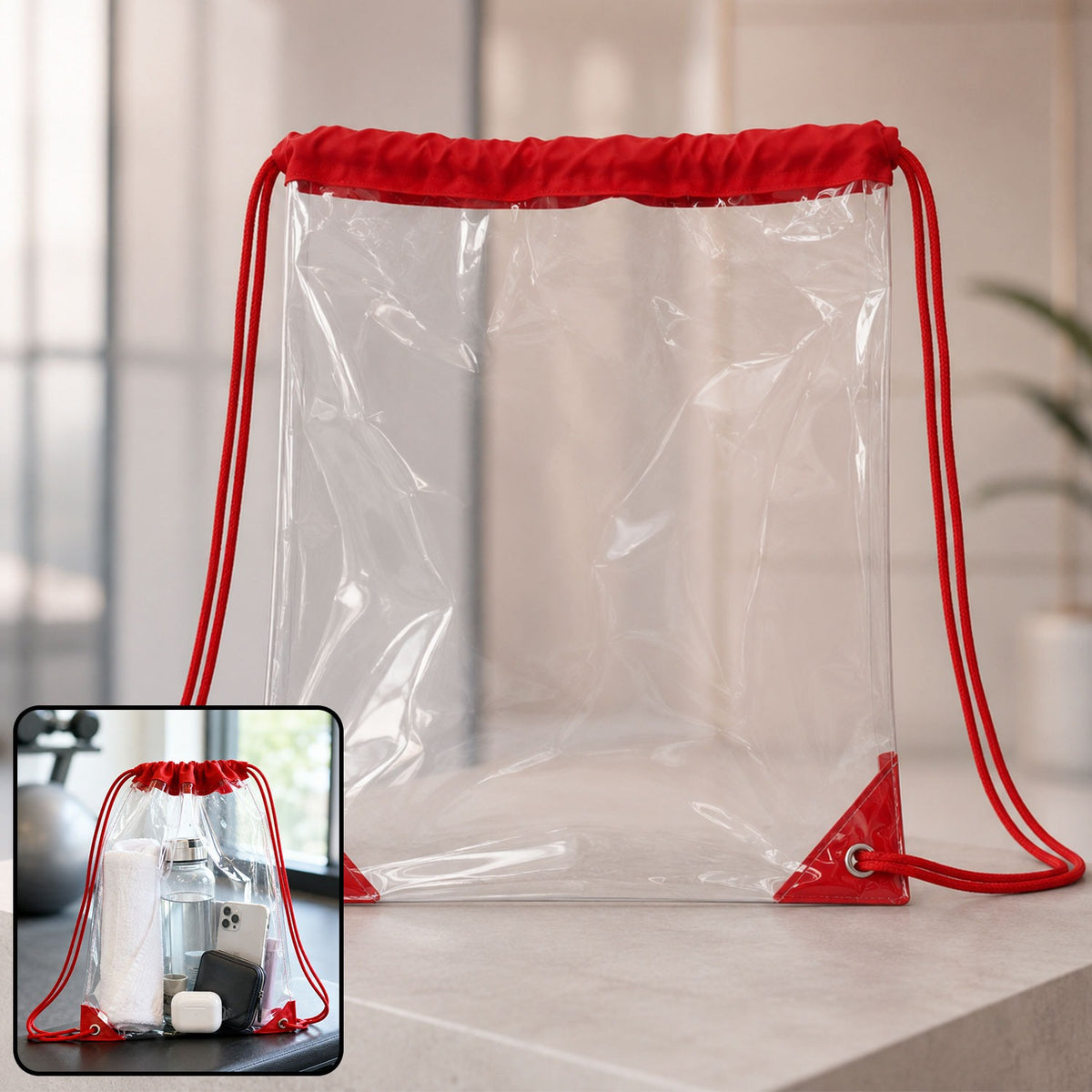 Clear drawstring bag with red cords and reinforced corners, shown on a light surface with a gym setting inset.