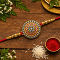 Royal Designer Rakhi – Kundan Centerpiece with Golden Beads