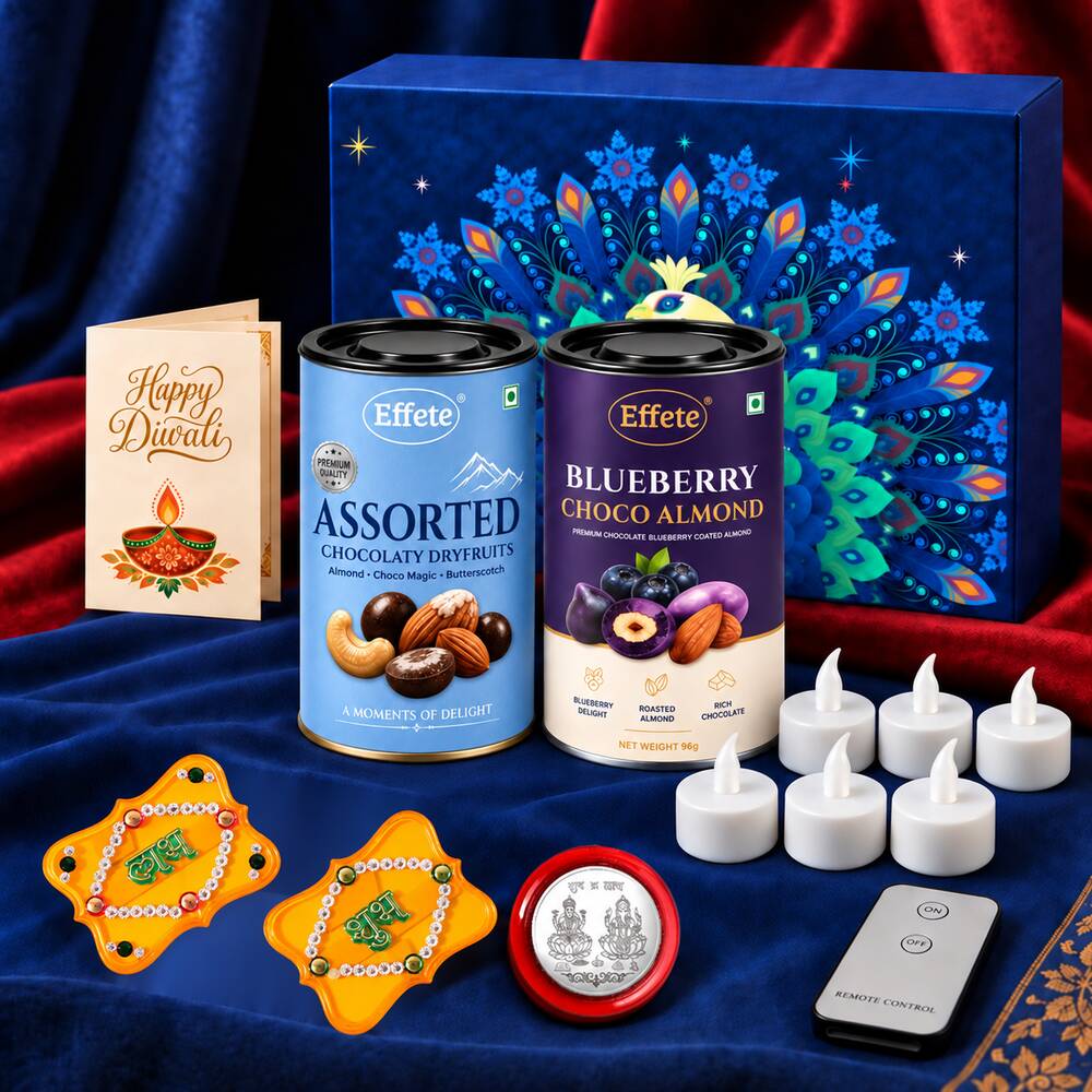 A blue box with a peacock design, two chocolate tins, a Diwali card, six white LED tealights, a remote, two yellow decor