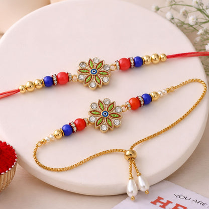 Elegant Bhaiya Bhabhi Rakhi Set featuring floral design and pearl drop Lumba on a festive background.