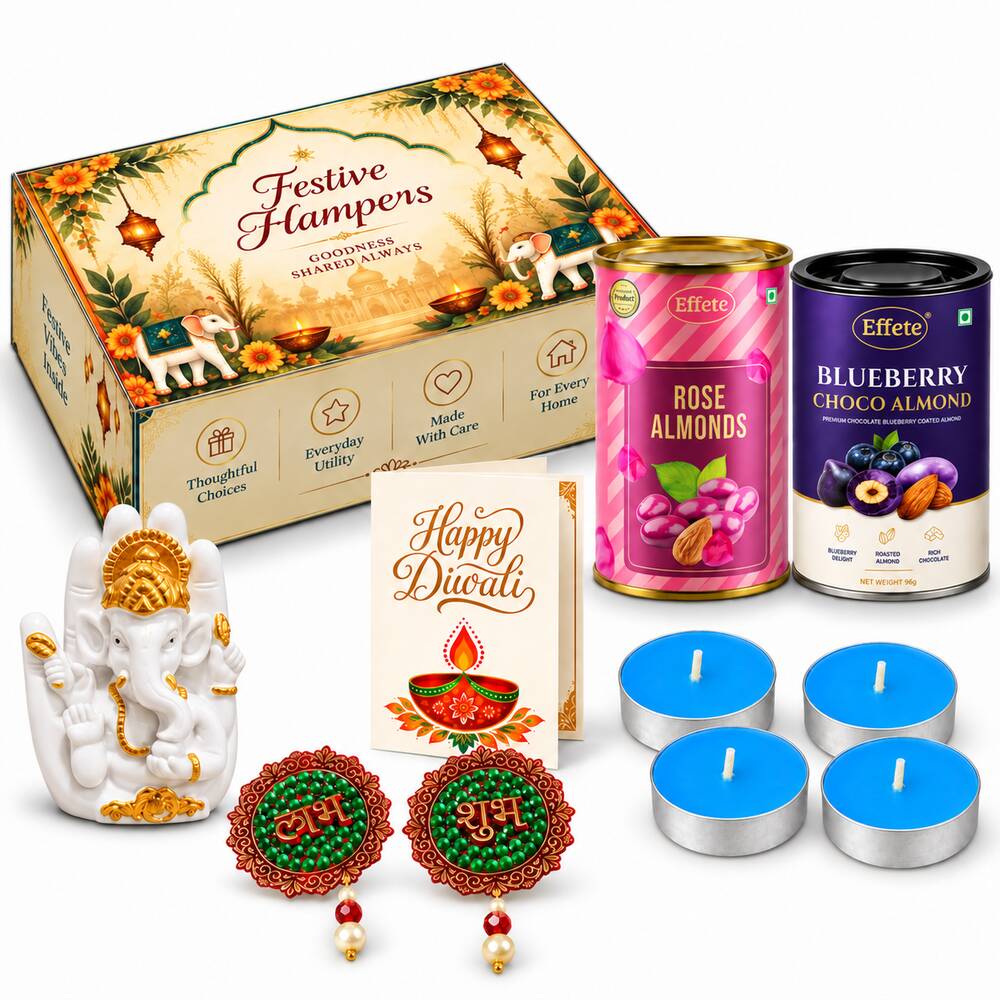 A white Ganesha idol, two tins of almonds, a Diwali card, four blue tealights, and two red and green Shubh Labh decorations